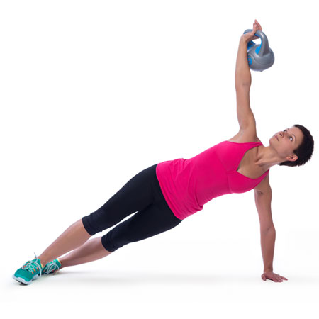 woman doing dumbbell strenght and balance exercies as part of a fitness coaching program